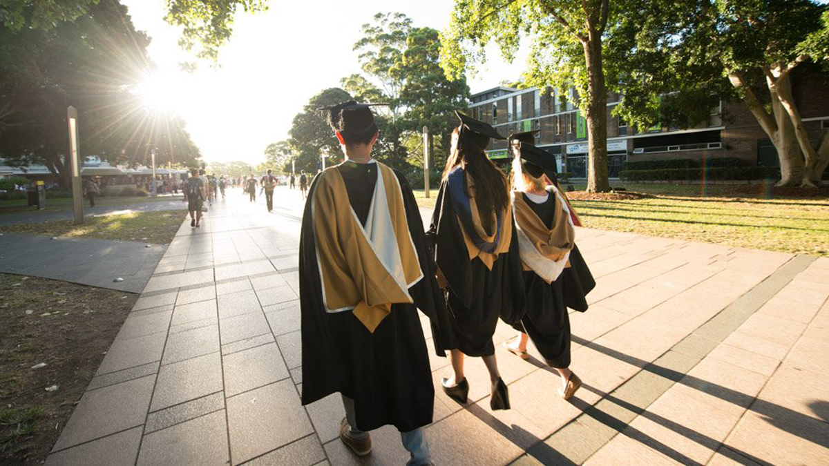 Graduates walking down the UNSW mall